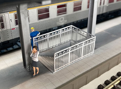 3D-printed underpass with wrought iron fence